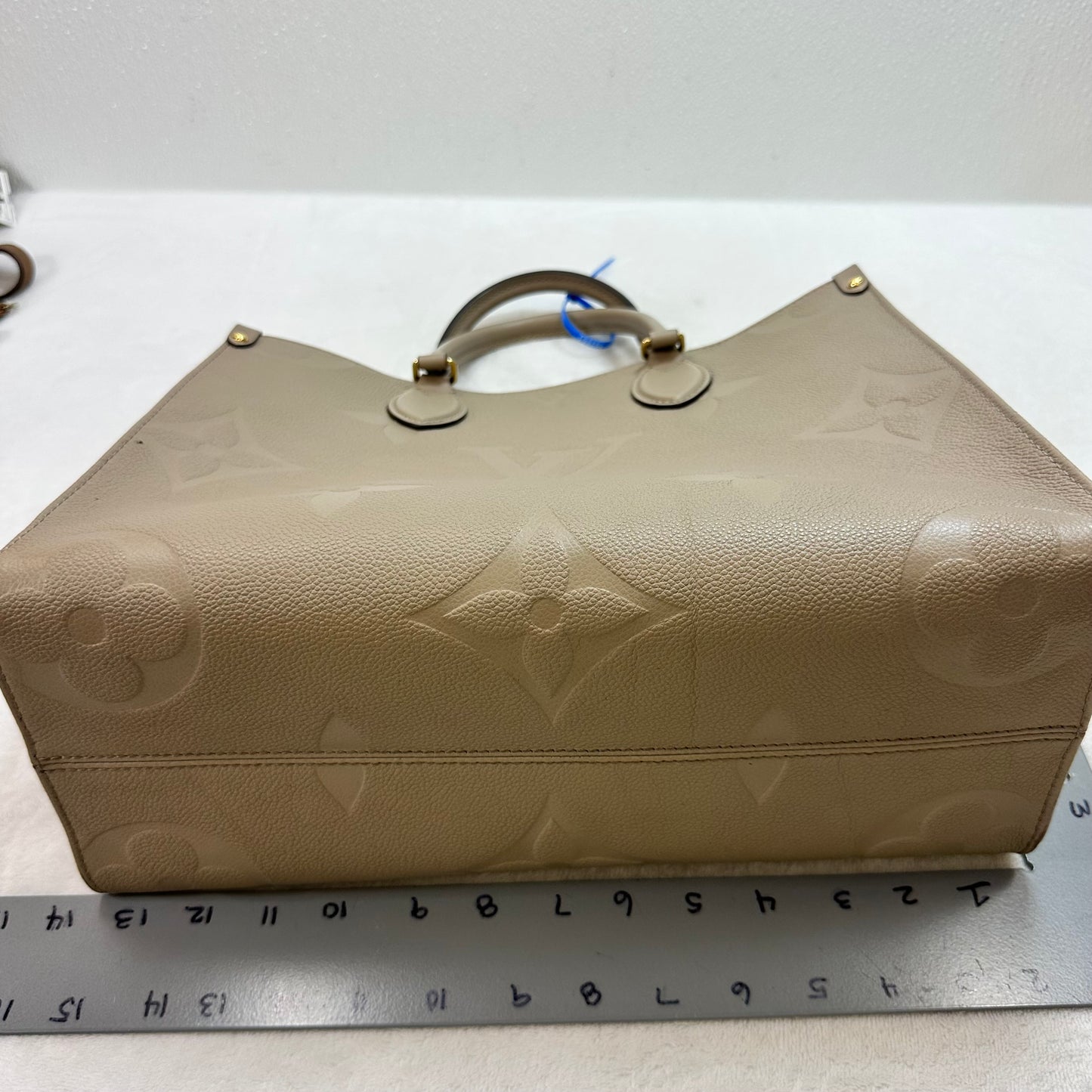 OnTheGo MM tote bag Tourterelle (turtledove) beige Monogram Empreinte leather Handbag Luxury Designer By Louis Vuitton, Size: Medium