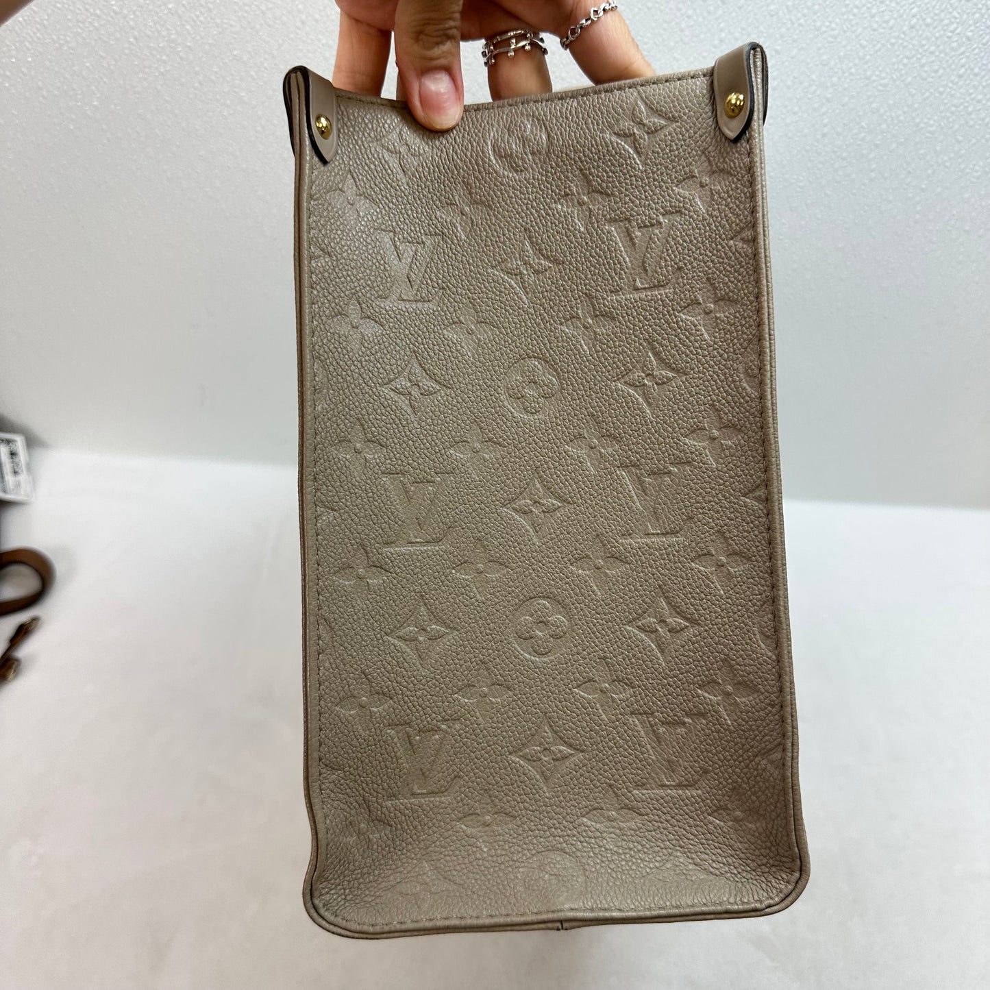 OnTheGo MM tote bag Tourterelle (turtledove) beige Monogram Empreinte leather Handbag Luxury Designer By Louis Vuitton, Size: Medium