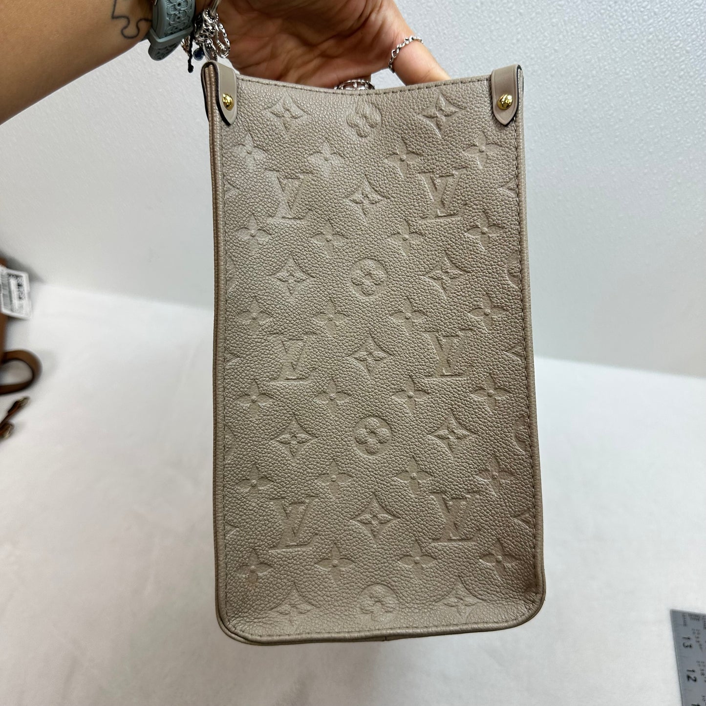 OnTheGo MM tote bag Tourterelle (turtledove) beige Monogram Empreinte leather Handbag Luxury Designer By Louis Vuitton, Size: Medium